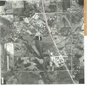 ["Aerial photo of Tahlequah, OK and Sequoyah School. Dimensions: 17 inches by 19 inches. Issued by the Department of the Interior, Bureau of Indian Affairs in 1976."]