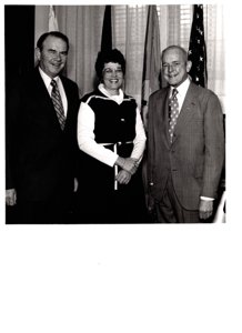 ["The image depicts Dewey Bartlett standing with Henry Bellmon and Jannie Coflis"]