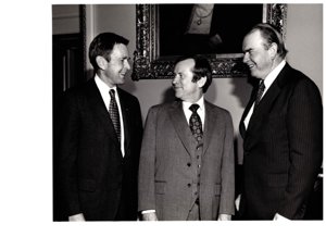 ["The image depicts Dewey Bartlett standing with Henry Bellmon and Howard Baker"]