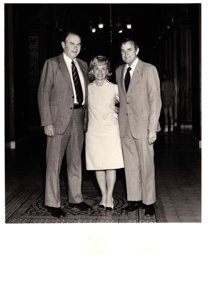 ["The image depicts Dewey Bartlett standing with Henry Bellmon and Paula Unruh in front of the Foreign Relations Office"]