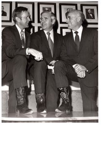 ["The image depicts Dewey Bartlett, Paul Laxalt and Clifford Hansen show off their cowboy boots"]