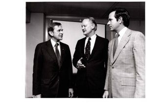 ["Dewey Bartlett standing with Ambassador Alonzo L. McDonald and H. John Heinz III, during a visit to the Tokyo Round Delegation in Geneva, Switzerland  - image 219"]