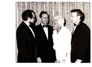 ["The image depicts Dewey Bartlett standing with Mrs. Oscar Hammerstein, George Nigh, and another gentlemen"]