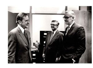 ["The image depicts Dewey Bartlett standing with L. R. McCleary and A.G. Foster"]