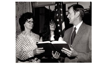 ["The image depicts Dewey Bartlett standing with the Oklahoma spelling champ, Beth Underwood and Virginia Nolan"]