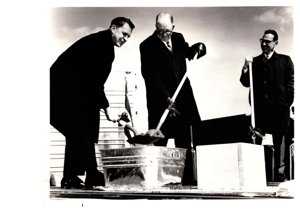 ["The image depicts Dewey Bartlett officiating with Robert King and Clifford W. Barrett, President, American Trailers, Inc., pouring the corner stone of their new plant at Northwest 10th Street and Morgan Road, Oklahoma City, Oklahoma"]