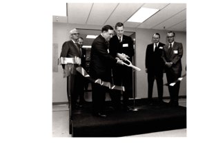 ["The image depicts Dewey Bartlett at a ribbon cutting for the 3M Plant Dedication in Weatherford"]