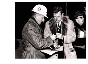 ["The image depicts Dewey Bartlett standing with Colonel Vernon W. Pinkey, District Engineer"]