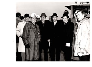 ["The image depicts Dewey Bartlett standing with Charles Gassaway, Colonel Pinkey, Colonel Ladd, Harold Scoggins, Ed Edmondson, and Brig. Gen. Parfitt"]