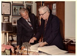 ["Color photograph of Tom Steed with Rex Davis, director of the Bureau of Alcohol, Tobacco and Firearms in his office."]